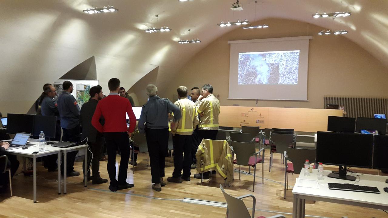 Firefighter briefing in the situation room of the Forest Sciences Centre of Catalonia (CTFC) in Solsona