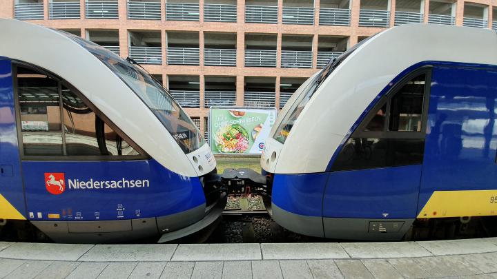 Example of two coupled commuter trains connected by a center buffer coupler.